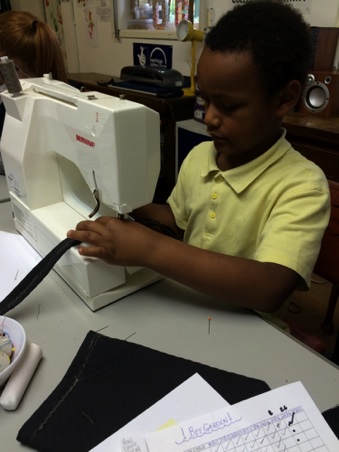 Sewing skills with volunteers.jpg